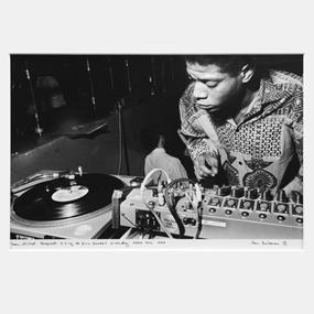 Jean-Michel Basquiat DJing at Eric Goode’s birthday, AREA, NYC, 1984 (First Edition) by Ben Buchanan