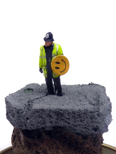 Aftermath Dislocation Principle Police Constable with a Smiley Riot Shield in a Jam Jar  by James Cauty