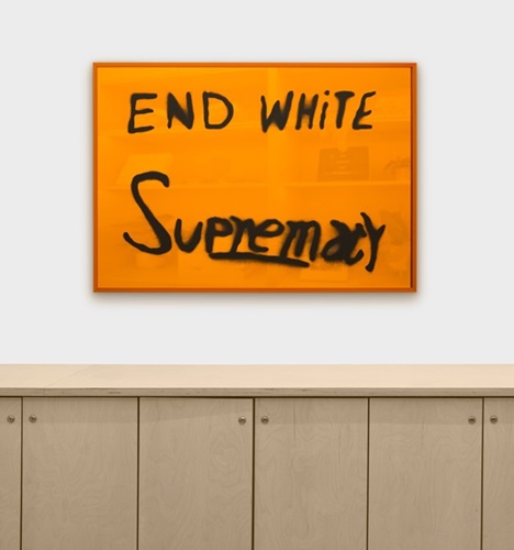 End White Supremacy (Mirrored Amber) by Sam Durant